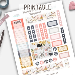 May include: Printable planner stickers with a pink, gold, and blue color scheme. The stickers feature a variety of designs, including hearts, a desk with a computer, and a flamingo. The text "Plan with the Happy Planner" is at the top of the sheet.