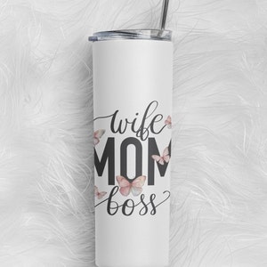 May include: White stainless steel tumbler with a black and white graphic that says "wife mom boss" with pink butterflies around the text.