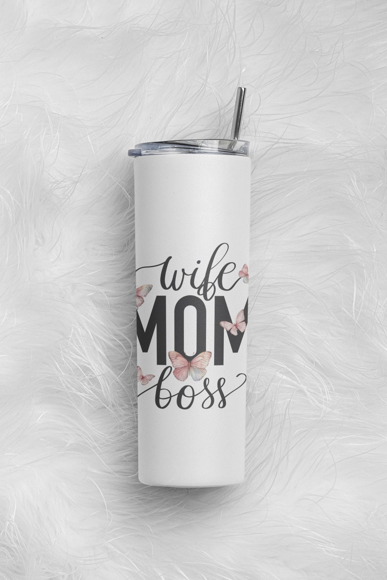 May include: White stainless steel tumbler with a black and white graphic that says "wife mom boss" with pink butterflies around the text.