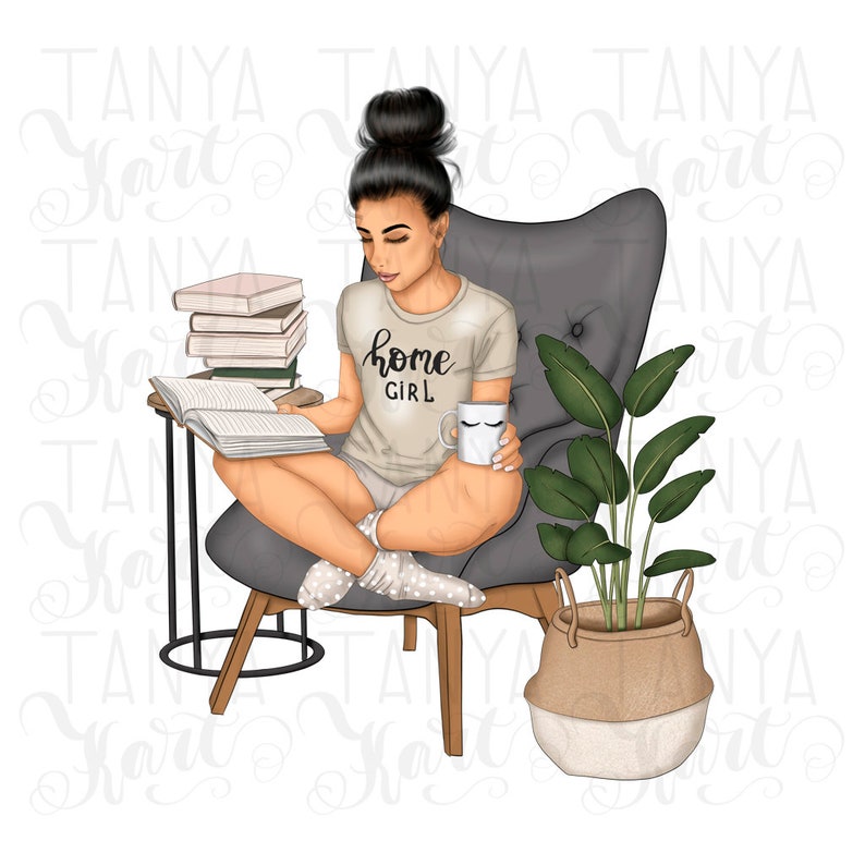 May include: A woman sits in a gray armchair reading a book. She is wearing a light gray t-shirt that says "home girl" and has a mug in her hand. There are several books stacked on a side table next to her and a potted plant in a woven basket.