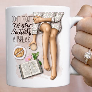 May include: White ceramic mug with a colorful illustration of a woman relaxing with a book, coffee, and pastries. The text "Don't forget to give yourself a break" is printed on the mug.