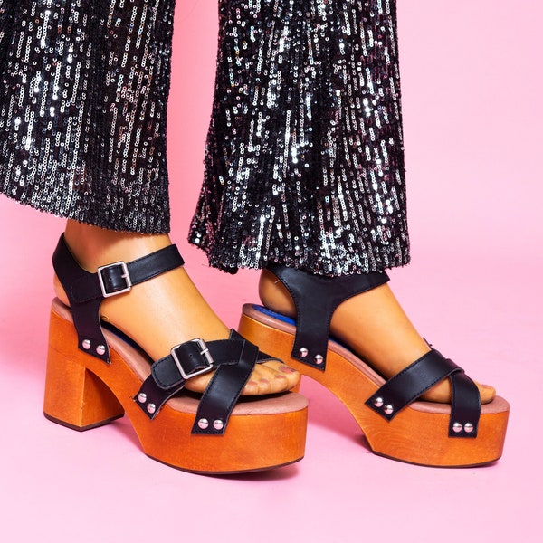 Oh babyy! The grooviest 1970s inspired studded wooden platform shoes