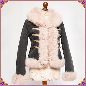 May include: A grey denim jacket with a pink faux fur collar, cuffs and lining. The jacket has gold-coloured buttons and straps.
