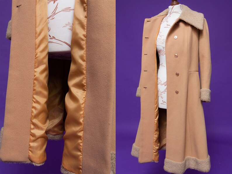 May include: A long, camel-colored coat with a faux fur collar and lining. The coat has a double-breasted closure and a flared skirt.