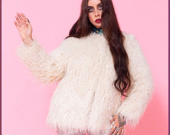 Iconic 70s style faux mongolian fur coat. Killer vintage style 70s shaggy faux fur jacket. So glamorous! Studio 54 vibes jacket. Size SMALL