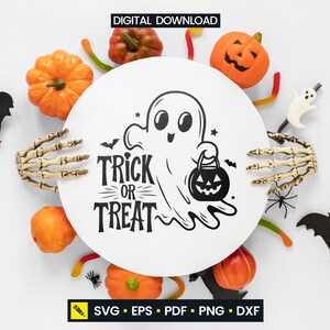 May include: A Halloween-themed digital download design featuring a smiling ghost holding a jack-o'-lantern bucket, with the words "Trick or Treat." The design is surrounded by pumpkins, bats, spiders, and a skeleton hand.