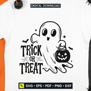 May include: White t-shirt featuring a black graphic of a friendly ghost holding a pumpkin-shaped treat bag. The words "Trick or Treat" are written in a bold, stylized font. Includes the text "DIGITAL DOWNLOAD" and file type icons.