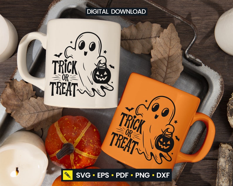May include: Two ceramic mugs with Halloween-themed designs. One is cream-colored, the other is orange. Both feature a ghost holding a jack-o'-lantern and the words "Trick or Treat". The mugs are on a rustic tray with fall decorations.