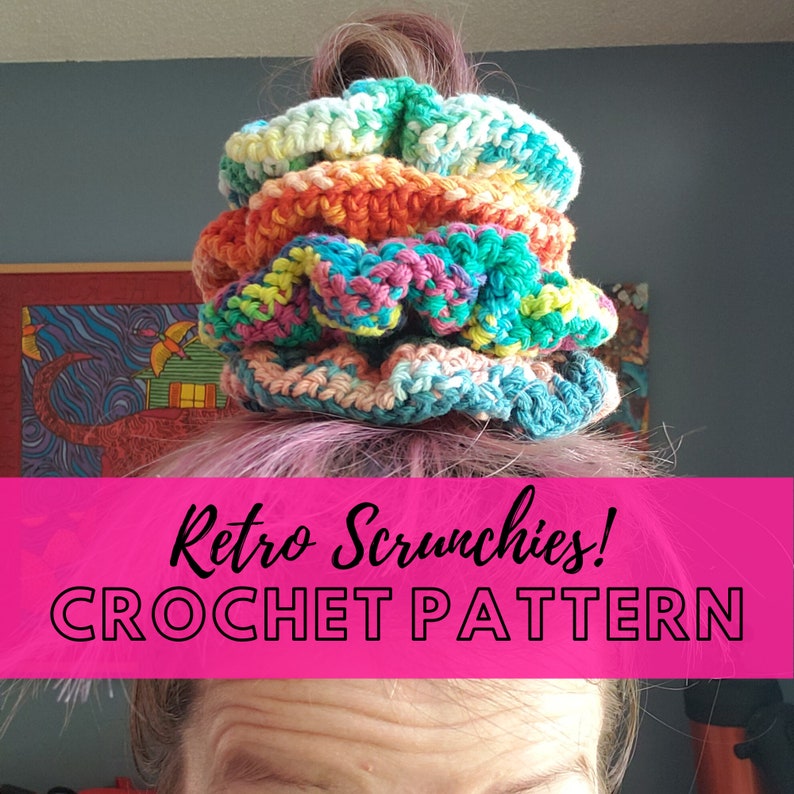 May include: A stack of colorful crocheted scrunchies in shades of green, blue, pink, orange, and yellow. The scrunchies are made with a textured stitch and are arranged in a stack on top of a person's head. The text "Retro Scrunchies! CROCHET PATTERN" is displayed on a pink background.