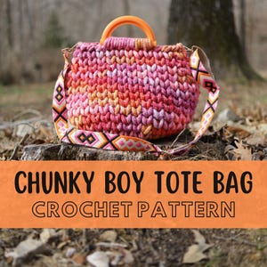 May include: A handmade, chunky crochet tote bag in shades of pink, orange, and yellow, with an orange handle and a patterned strap. The bag is sitting on a tree stump. The text "CHUNKY BOY TOTE BAG CROCHET PATTERN" is displayed on an orange banner.