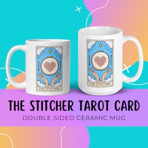 May include: White ceramic mug with a double-sided design. One side features a tarot card illustration of a hand holding a needle and thread with a heart-shaped cross-stitch in the center. The card reads "The Stitcher".