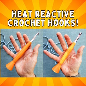May include: Image of two orange heat reactive crochet hooks. The text "HEAT REACTIVE CROCHET HOOKS!" is displayed at the top of the image. The crochet hooks are held in hands, with blue yarn in the background.