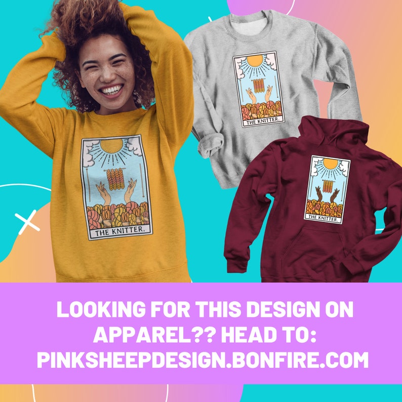 May include: Mustard yellow sweatshirt, gray long-sleeve shirt, and maroon hoodie. Each garment features a tarot card design with the text "THE KNITTER." The design includes hands knitting under a sun. The bottom of the image has the text "LOOKING FOR THIS DESIGN ON APPAREL?? HEAD TO: PINKSHEEPDESIGN.BONFIRE.COM."