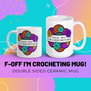 May include: Two white ceramic mugs with the text "FUCK OFF I'M CROCHETING". The mugs have a design of yarn balls and flowers in orange, purple, and teal. The mugs are double-sided.