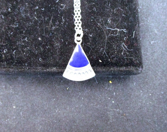 Charm on a chain of lapis lazuli stone