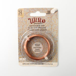 May include: A package of copper-colored German-style wire, 24 gauge, semi-flexible. The package reads "Wire elements" and includes text in French and Spanish. The wire is 13.12 yards or 12 meters.
