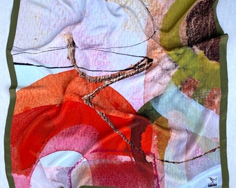 May include: A square scarf featuring an abstract print with vibrant shades of orange, red, pink, and olive green. The design includes thin black lines and textured shapes, finished with a solid olive green border and a small logo tag reading DEERA BIRD.