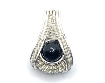 Tibetan Tektite wire wrapped gemstone pendant . A Catalyst For Spiritual Development