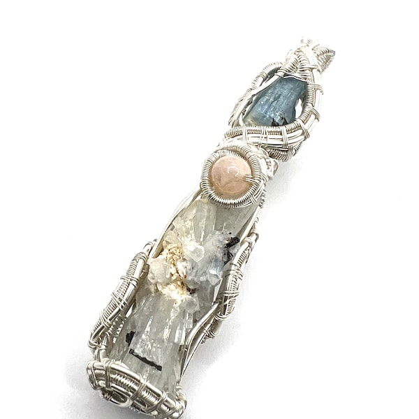 Goshenite gemstone pendant with Aquamarine and Morganite wire wrapped in fine silver.  Beryl Bomb