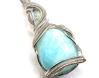 Blue Aragonite with Ethiopian Opal wire wrapped in fine silver.  Becoming Emotionally Free