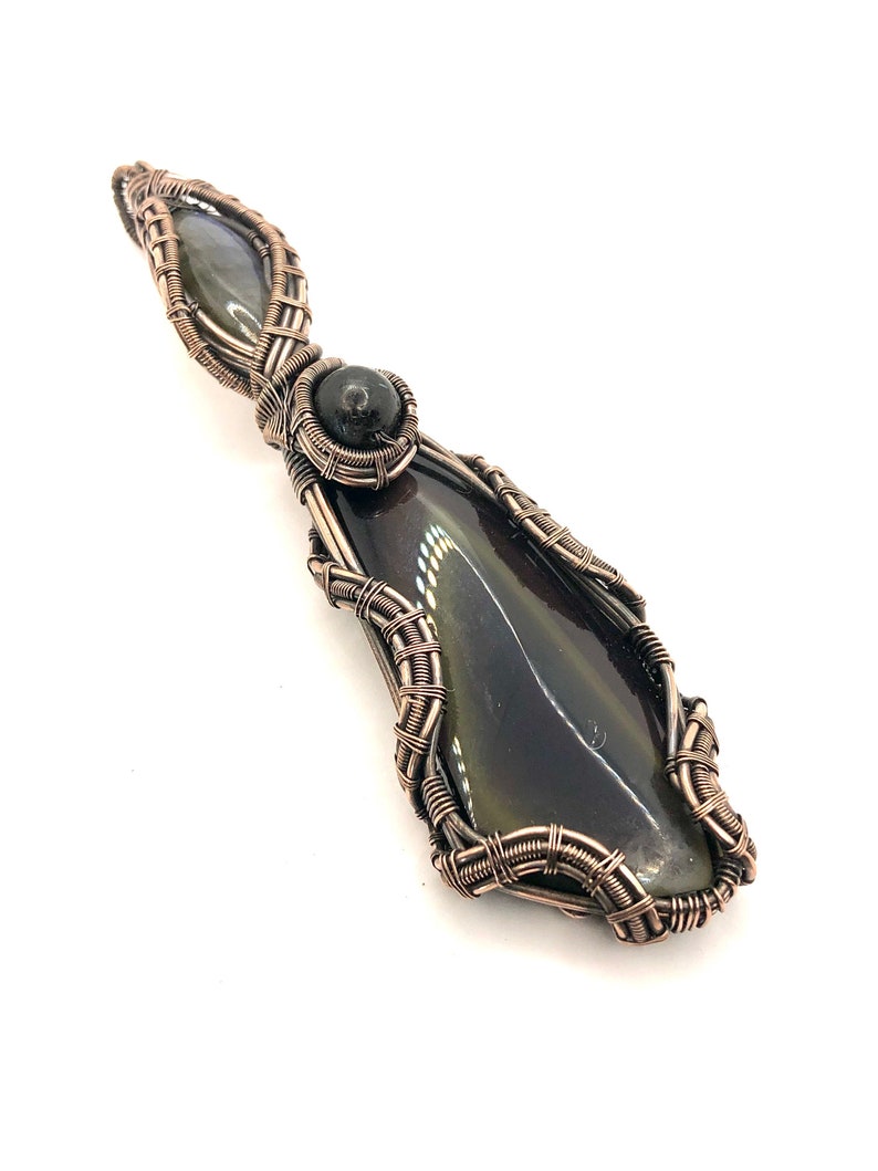 Mastering The Darkness That Lives Within Each Of Us in copper Rainbow Obsidian gemstone pendant with Labradorite and Nuummite