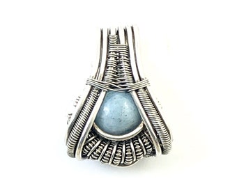 Aquamarine pendant wire wrapped in fine silver.  Emotional Soothing