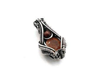 Sunstone gemstone pendant with Pietersite wire wrapped in fine silver. Enlightened Leadership