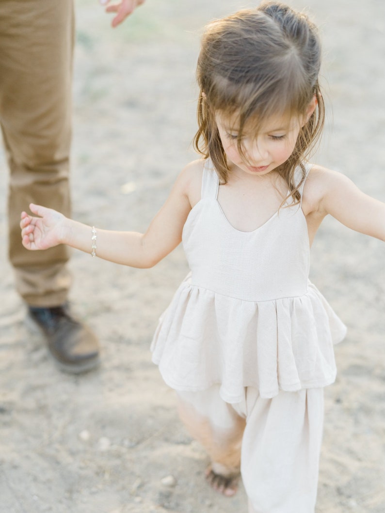 Girls boho romper linen tan, white, black with adjustable straps and ruffled waist, wide leg image 5