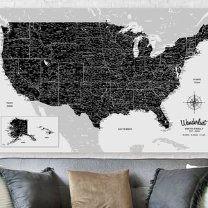 May include: A black and white map of the United States with all states labeled. The map is on a gray background with a compass and the text "Wanderlust Smith Family Est. 2000" in the bottom right corner.