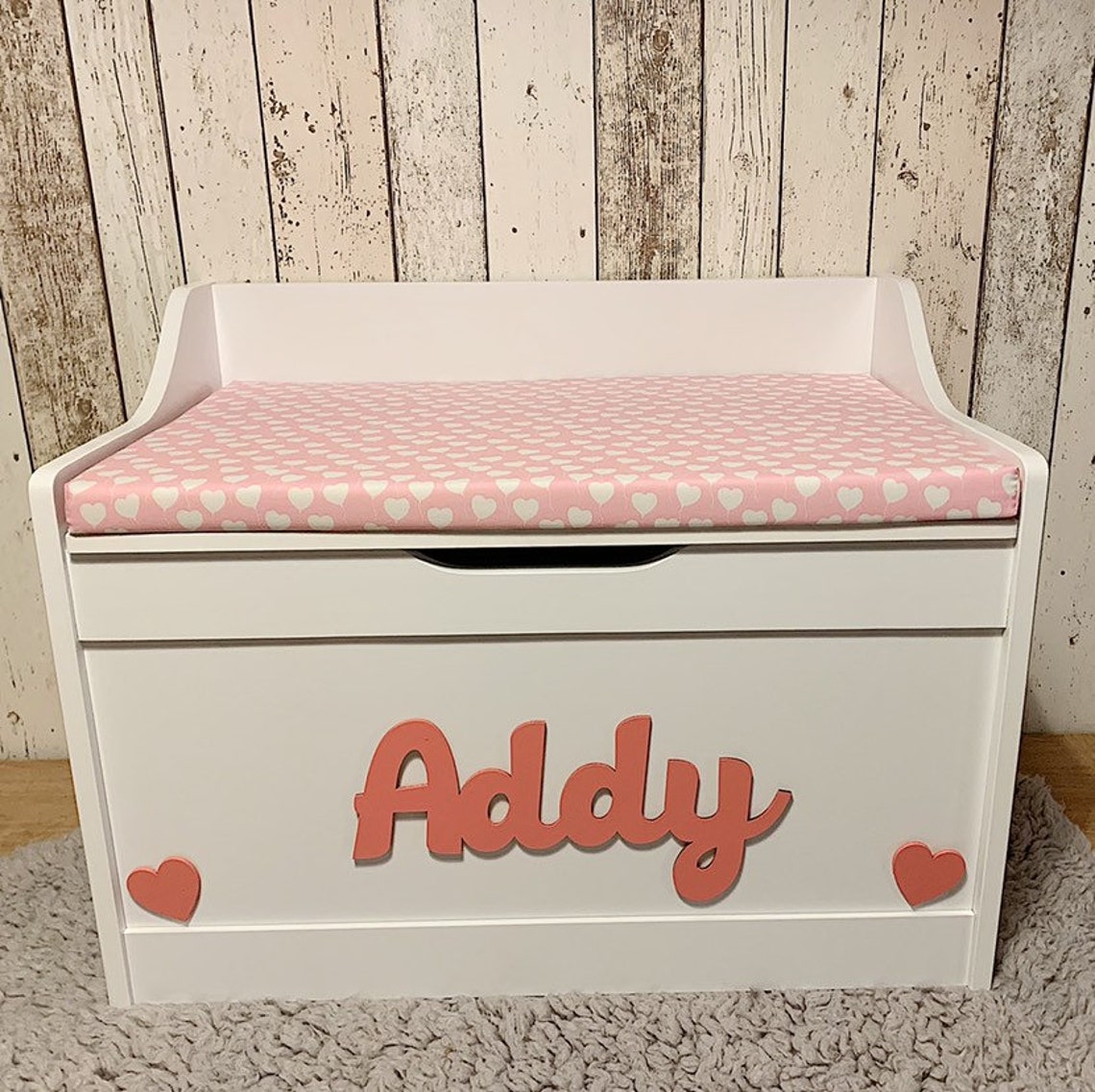 white toy box with cushion