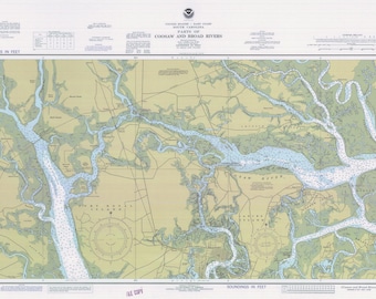 May include: A nautical chart of the Corsaw and Broad Rivers in South Carolina. The chart shows the waterways, islands, and surrounding land. The chart is printed in black and white with blue and green markings.