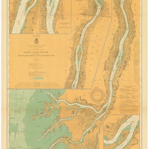 May include: A vintage nautical chart of the Saint Clair River, Port of Lake Huron, and the St. Clair Flats Canal. The chart is printed on a cream-colored paper with blue and green markings. The chart shows the river and canal with various depths and locations of buoys and other navigational aids.