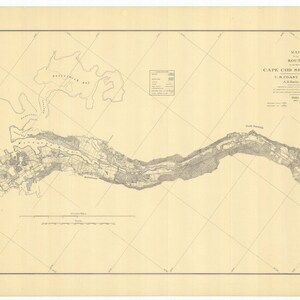 May include: A vintage map of the Cape Cod Ship Canal, featuring detailed geographical information. The map is printed in shades of gray on a cream-colored paper, with grid lines and text labels. The title "Cape Cod Ship Canal" is visible.