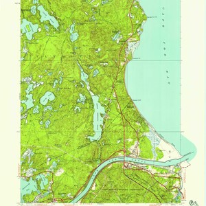 May include: A vintage topographic map of the Sagamore, Massachusetts area. The map shows the Cape Cod Canal, Cape Cod Bay, and the surrounding land. The map is printed in green, blue, and brown.