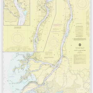 May include: A nautical chart of the Saint Clair River in Michigan, showing the river's course, islands, and surrounding land. The chart includes depth soundings in feet, navigational aids, and other important information for boaters.