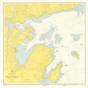 May include: A nautical chart of Salem, Marblehead and Beverly Harbors in Massachusetts. The chart shows the coastline, islands, and waterways of the area. The chart is in black and white with yellow and blue highlights.