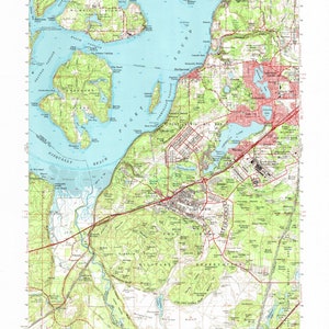 May include: A vintage topographic map of Anderson Island, Washington, showing the surrounding area including Puget Sound, Carr Inlet, and Fort Lewis. The map is printed in green, brown, and blue, with red lines indicating roads and other features. The map includes the text "Anderson Island, Wash." and "TACOMA".
