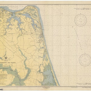 May include: A vintage nautical chart of Camp Pendleton and vicinity, showing the coastline and surrounding waterways. The chart is printed on a cream-colored paper with blue and green lines and text. The chart includes a compass rose and a scale bar.