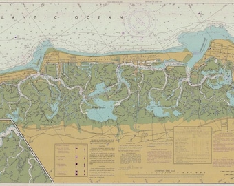 May include: A detailed nautical chart of a coastal area with a large body of water and numerous inlets and waterways. The chart is printed on a light beige background with blue lines and text. The chart includes depth soundings, navigational aids, and other important information for mariners.