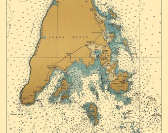 May include: A vintage nautical chart of Grand Manan Island, Maine, with detailed markings for navigation. The chart features a light blue and beige color scheme with brown lines and text. The island is surrounded by water with numerous islands and inlets.