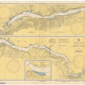 May include: A vintage nautical chart of the Columbia River from Bonneville to The Dalles, Oregon and Washington. The chart is printed on yellow paper with blue lines and text. The chart includes a compass rose, depth soundings, and other navigational information.