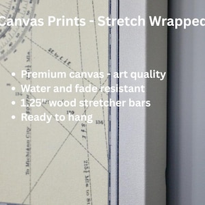 The image is a canvas print that has been stretched and is ready to hang. It features a map or compass with various lines and markings, and it is described as a premium canvas with art quality, water and fade resistant, and 1.25" wood stretcher bars.