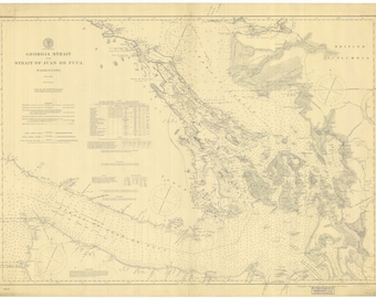 May include: A vintage map of the Georgia Strait and the Strait of Juan de Fuca, showing the coastline and islands of British Columbia and Washington State. The map is printed in black and white on a cream-colored paper.