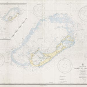May include: A vintage nautical map of the Bermuda Islands, featuring detailed coastlines in yellow and blue against a cream-colored background. The map includes compass roses and text indicating the islands' name and other geographical details. The map is a historical document.
