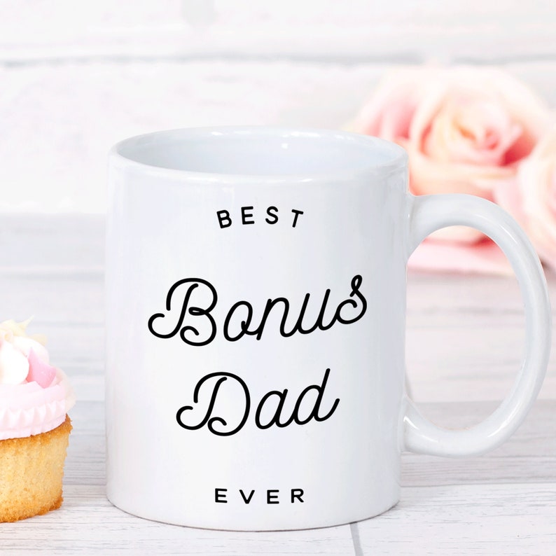 May include: White ceramic mug with black text that reads "Best Bonus Dad Ever".