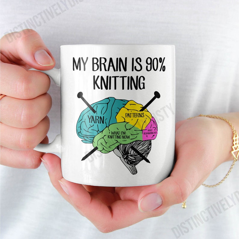 May include: White ceramic mug with the text "MY BRAIN IS 90% KNITTING" and a brain diagram showing knitting-related sections. The diagram includes sections labeled "YARN", "PATTERNS", and "WHAT I'M KNITTING NOW".