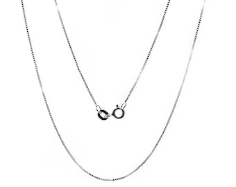 May include: A silver chain necklace with a lobster clasp.