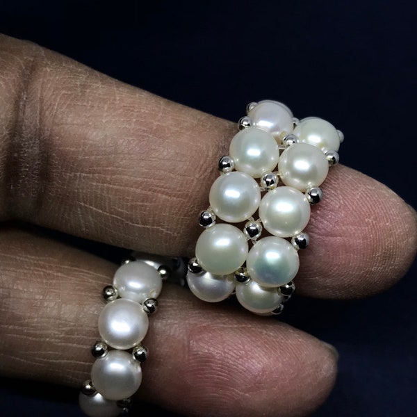 Beautiful White Pearl Ring ,On elastic thread, 100% Natural , 8 to 11 One size  fits brilliantly to all. StackableAl around finger (JB-0088)