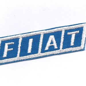 May include: A blue and white embroidered patch with the word "FIAT" in white lettering.