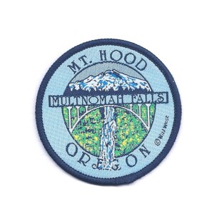 May include: A blue and white embroidered patch with the text "MT. HOOD OREGON" and "MULTNOMAH FALLS" with a depiction of a mountain and waterfall.